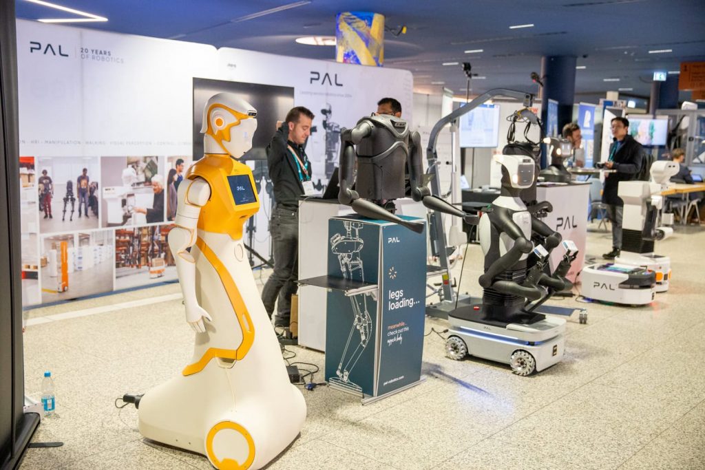 few robots lining up at an exhibition